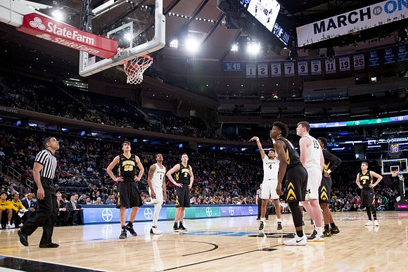 Charles Matthews (1), Isaiah Livers (4), and Jon Teske (15)