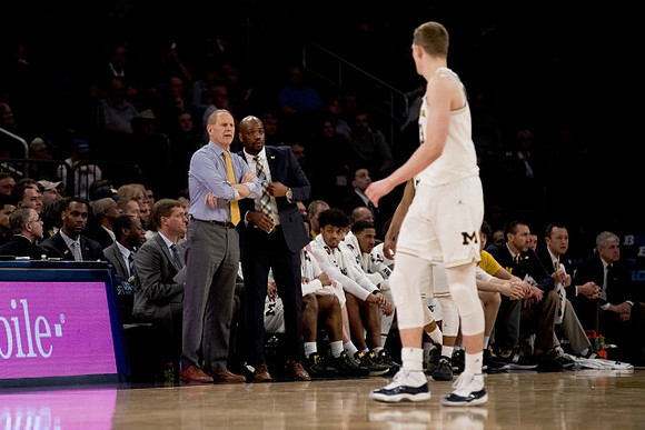 John Beilein, Deandre Haynes, Moritz Wagner (13), and Michigan Team