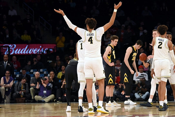 Charles Matthews (1), Isaiah Livers (4), Duncan Robinson (22), Jordan Poole (2), and Zavier Simpson (3)