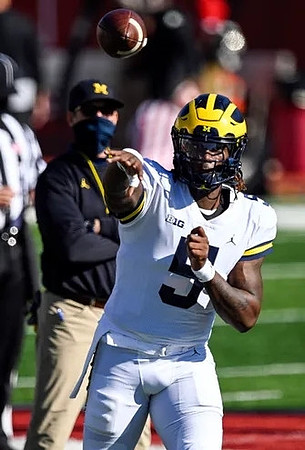 Joe Milton (5) and Jim Harbaugh