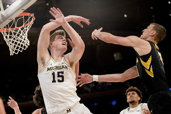 Jon Teske (15) and Isaiah Livers (4)