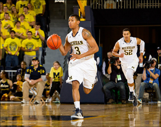 Trey Burke (3) and Jordan Morgan (52)