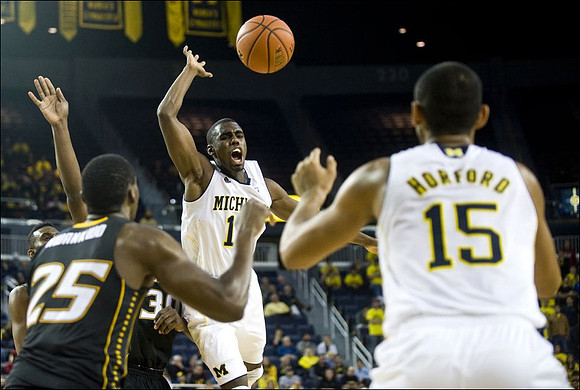 Tim Hardaway Jr. (10) and Jon Horford (15)