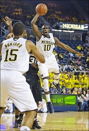 Jon Horford (15) and Tim Hardaway Jr. (10)