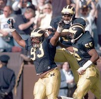 Sam Sword (93), Dhani Jones (55), and  Charles Woodson (2)
