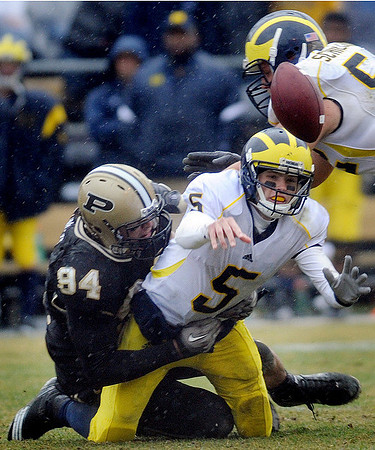 Tate Forcier (5) and Stephen Schilling (52)