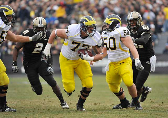 Stephen Schilling (52), Taylor Lewan (77), and David Molk (50)