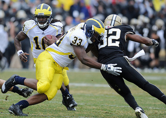 Stephen Hopkins (33) and Denard Robinson (16)