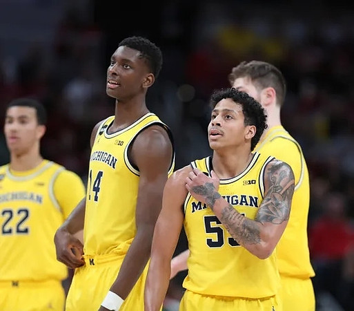Caleb Houstan (22), Moussa Diabate (14), Eli Brooks (55), and Hunter Dickinson (1)