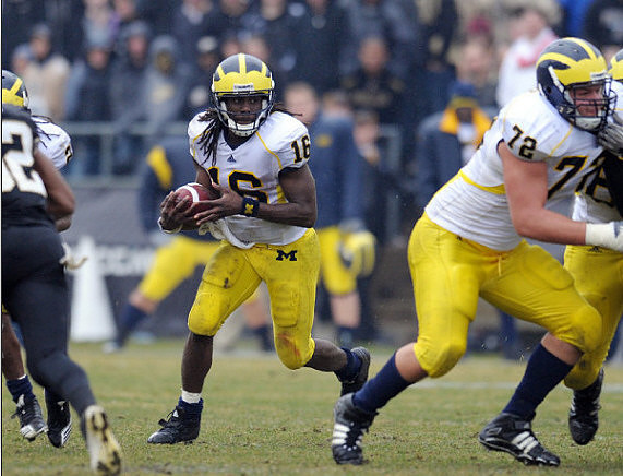 Denard Robinson (16) and Mark Huyge (72)