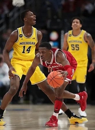 Moussa Diabate (14) and Eli Brooks (55)