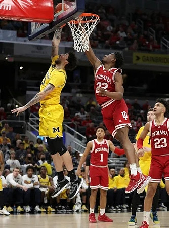 Brandon Johns Jr. (23) and Hunter Dickinson (1)