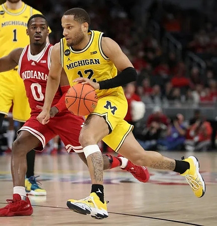 DeVante' Jones (12) and Hunter Dickinson (1)