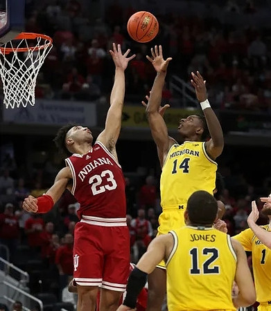 Moussa Diabate (14), DeVante' Jones (12), and Hunter Dickinson (1)