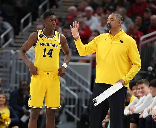 Moussa Diabate (14) and Juwan Howard