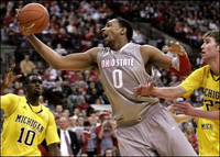 Tim Hardaway Jr. (10) and Evan Smotrycz (23)