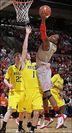 Evan Smotrycz (23), Stu Douglass (1), and Tim Hardaway Jr. (10)