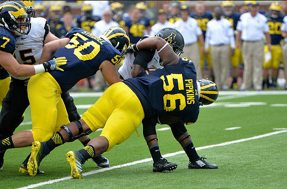 Henry Poggi (7), Tom Strobel (50), and Ondre Pipkins (56)