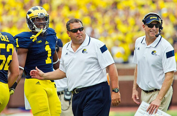 Mason Cole (52), Devin Funchess (1), Brady Hoke, and Doug Nussmeier