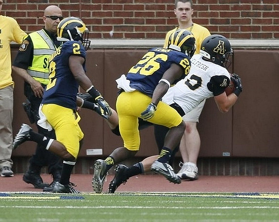 Blake Countess (2) and Jourdan Lewis (26)