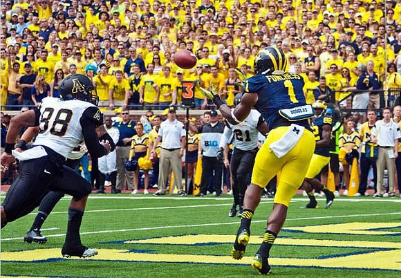 Devin Funchess (1) and Amara Darboh (82)