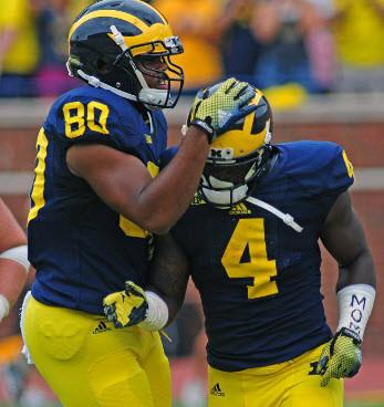 Khalid Hill (80) and De'Veon Smith (4)