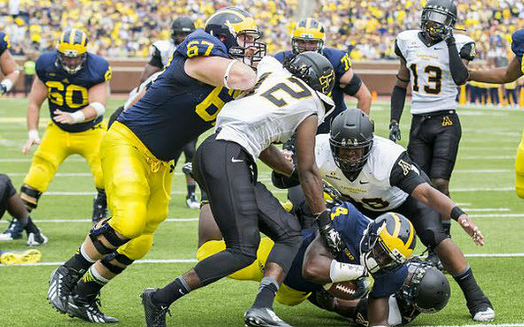 Jack Miller (60), Kyle Kalis (67), and De'Veon Smith (4)
