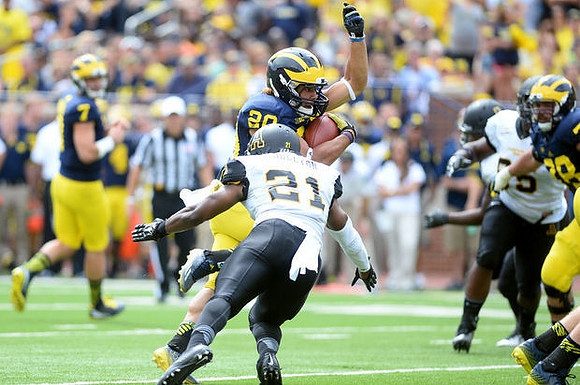 Shane Morris (7) and Drake Johnson (20)
