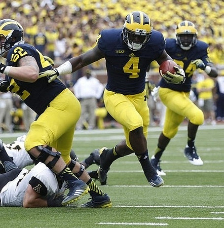 Mason Cole (52), De'Veon Smith (4), and A.J. Williams (84)