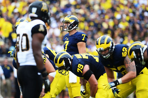 Erik Magnuson (78), Shane Morris (7), and Mason Cole (52)