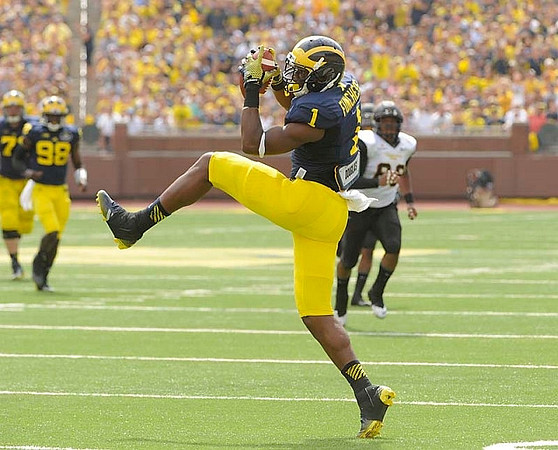 Devin Funchess (1) and Devin Gardner (98)