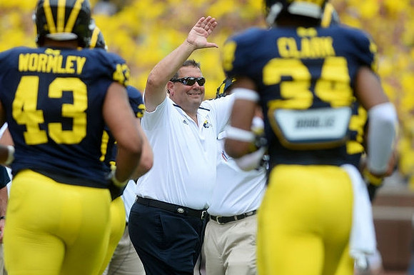 Chris Wormley (43), Brady Hoke, and Jeremy Clark (34)