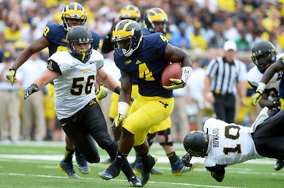 Khalid Hill (80) and De'Veon Smith (4)