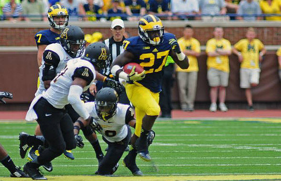 Shane Morris (7) and Derrick Green (27)