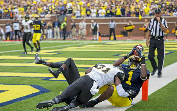 Devin Funchess (1) and Amara Darboh (82)