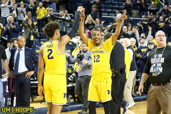 Jordan Poole (2) and Muhammad-Ali Abdur-Rahkman (12)