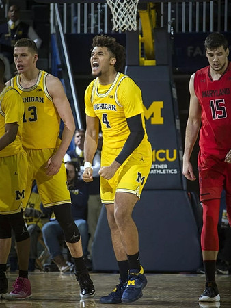 Moritz Wagner (13) and Isaiah Livers (4)