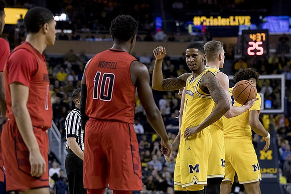 Charles Matthews (1), Moritz Wagner (13), and Isaiah Livers (4)