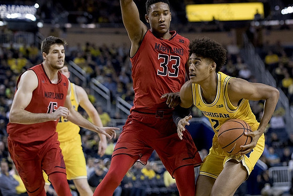 Jon Teske (15) and Jordan Poole (2)