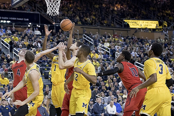 Duncan Robinson (22), Charles Matthews (1), Muhammad-Ali Abdur-Rahkman (12), and Zavier Simpson (3)
