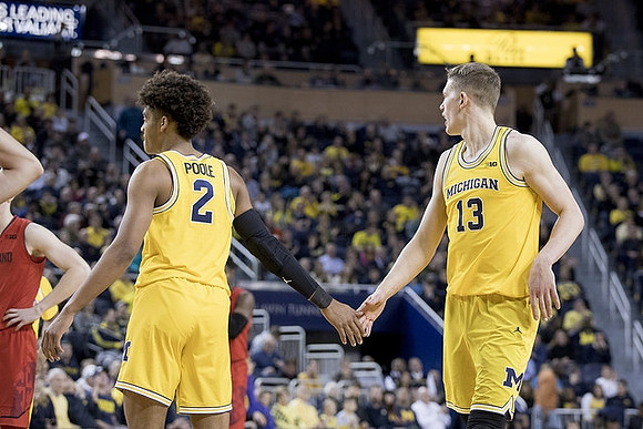 Jordan Poole (2) and Moritz Wagner (13)