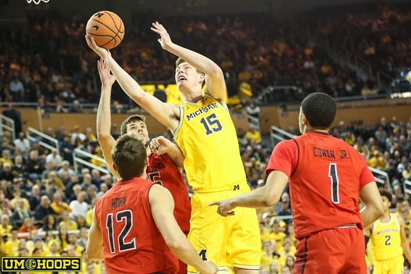 Jon Teske (15) and Jordan Poole (2)