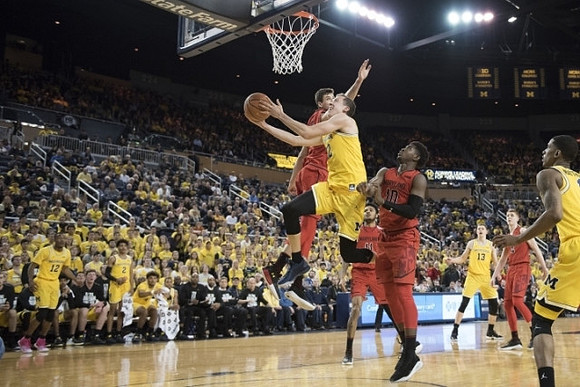 Duncan Robinson (22), Moritz Wagner (13), and Charles Matthews (1)
