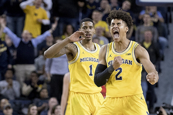 Charles Matthews (1) and Jordan Poole (2)