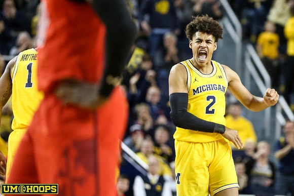 Charles Matthews (1) and Jordan Poole (2)