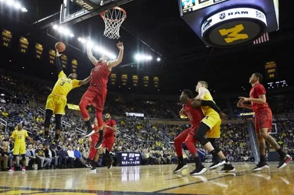 Muhammad-Ali Abdur-Rahkman (12), Zavier Simpson (3), and Moritz Wagner (13)