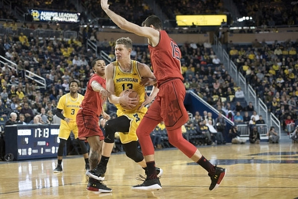 Zavier Simpson (3) and Moritz Wagner (13)
