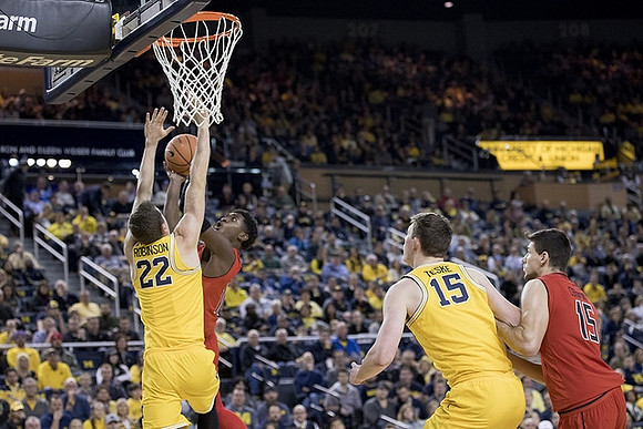 Duncan Robinson (22) and Jon Teske (15)