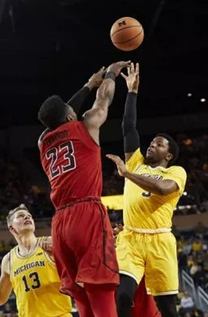 Moritz Wagner (13) and Zavier Simpson (3)