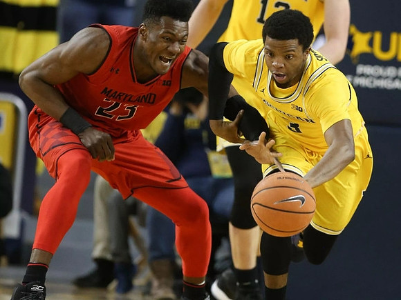 Moritz Wagner (13) and Zavier Simpson (3)